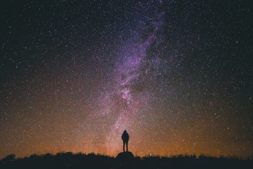 The Sanctity of Life (poem): person standing under starry night sky