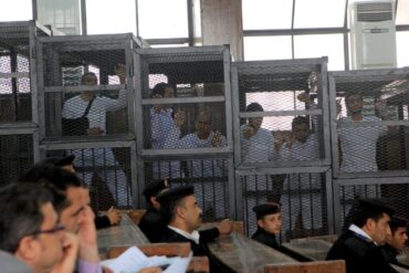 Members of the Muslim Brotherhood opposition being tried by an Egyptian court
