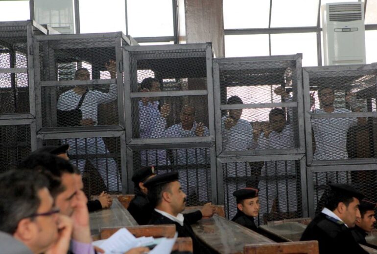 Members of the Muslim Brotherhood opposition being tried by an Egyptian court