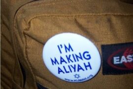 Parshat Vayigash - "I'm Making Aliyah" button on a backpack