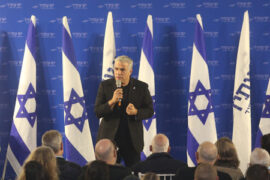 Yair Lapid at Yesh Atid party election event, interrupted by activist Elie Yosef