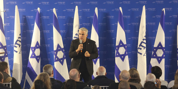 Yair Lapid at Yesh Atid party election event, interrupted by activist Elie Yosef