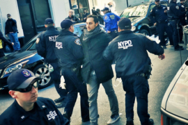 Yotam Marom being led away by police