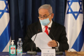 Covid-19 & Israel's Political Map with Mordechai Taub. Pictured is Prime Minister Binyamin Netanyahu in a protective mask.