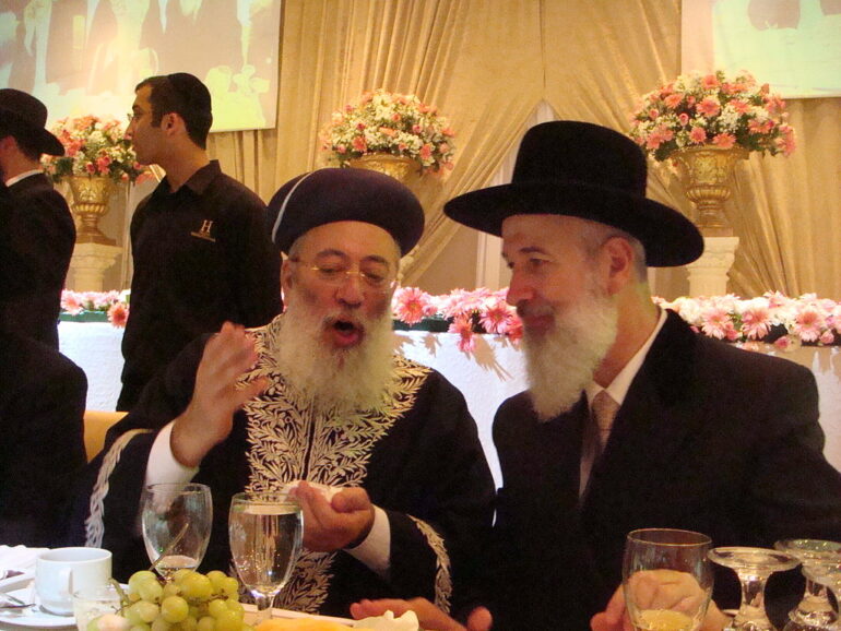 Image of Chief Rabbis of Israel - what is meant by "halakhic state"?